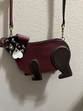 kate spade burgundy and dark brown dog-shaped crossbody bag